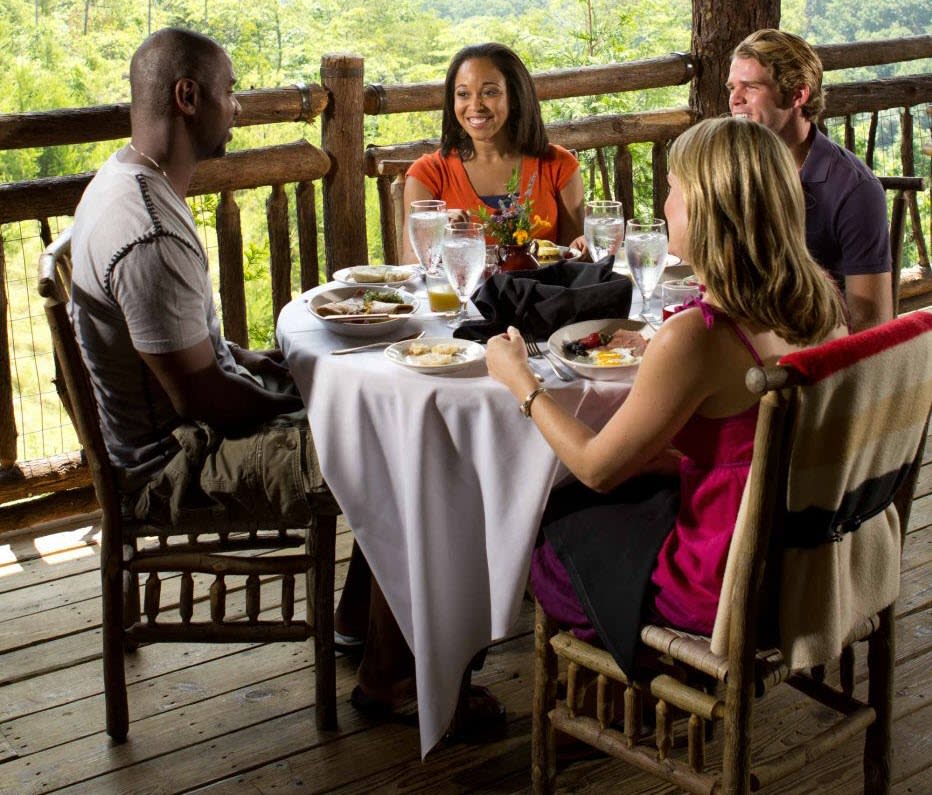 People Dining at Table on Porch