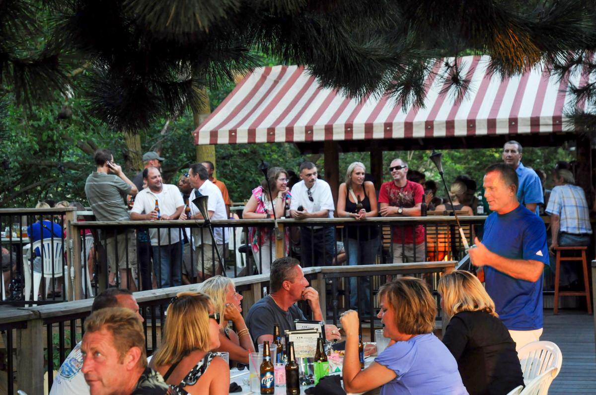 People enjoying The Deck's waterfront atmosphere People enjoying The Deck's waterfront atmosphere