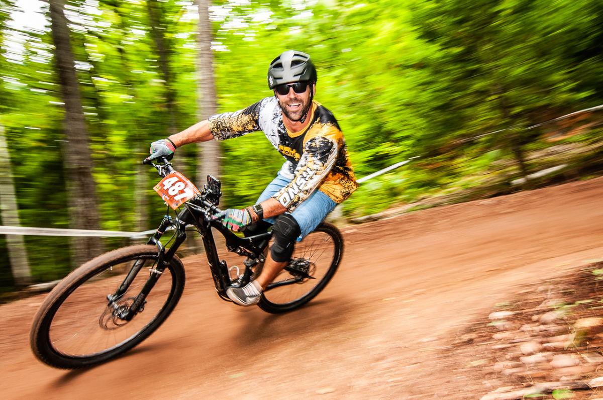 Mountain biker flowing at the Keweenaw Mountain Lodge Copper Harbor Trails Fest
