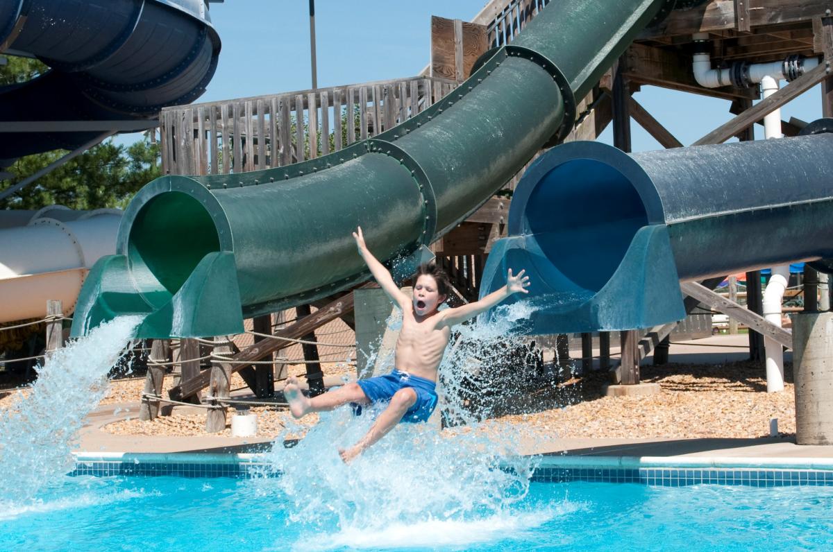 Splashdown Water Park - Boy exiting slide