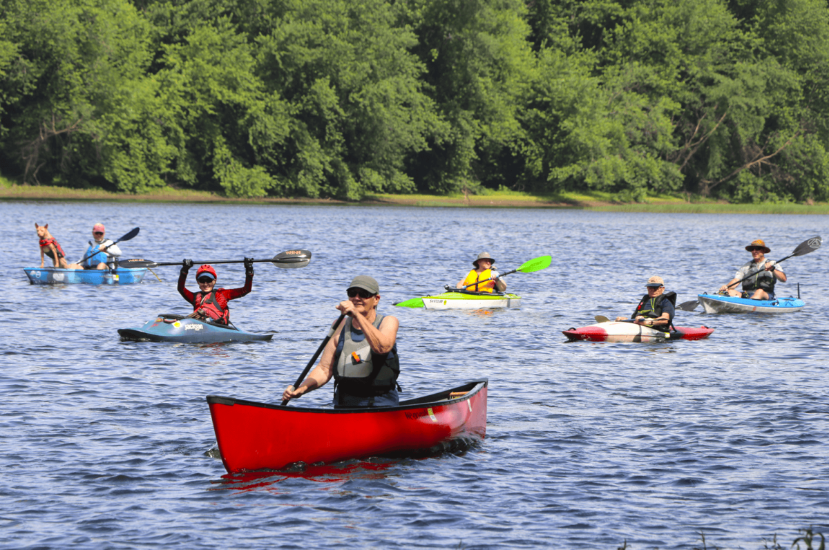 Group of people kayaking on the river