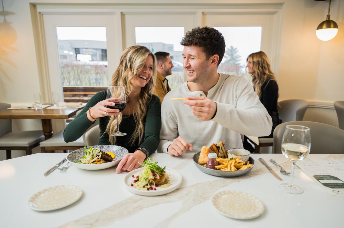 Couple eating at The Burrow