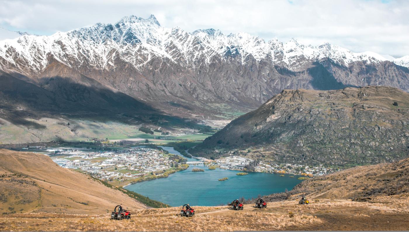 Nomad Safaris Quad Bike Tour on Queenstown Hill, with Lake and Remarkables in the background