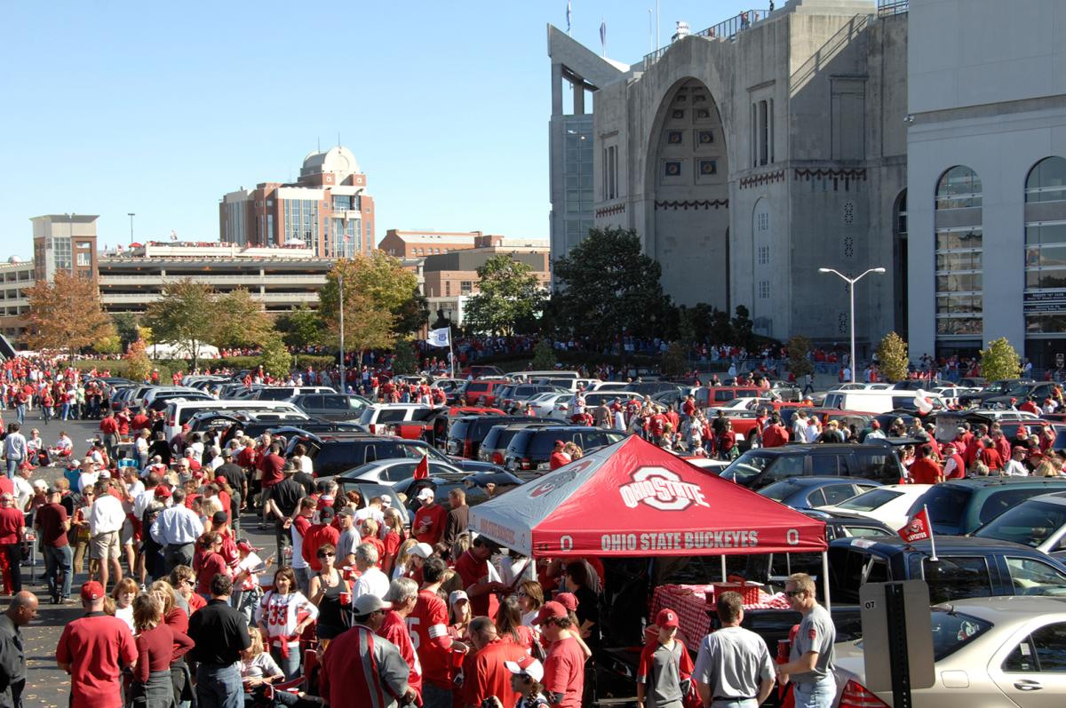 Parking lot outside of Ohio Stadium filled with tailgaters before football game