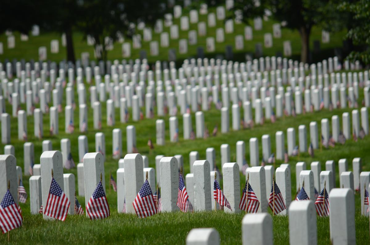Multiple Head Stones and American Flags