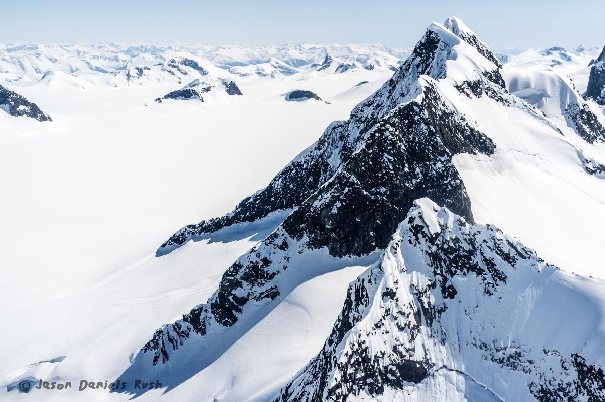 The Juneau Ice Field extending far into the horizon with stunning white snow