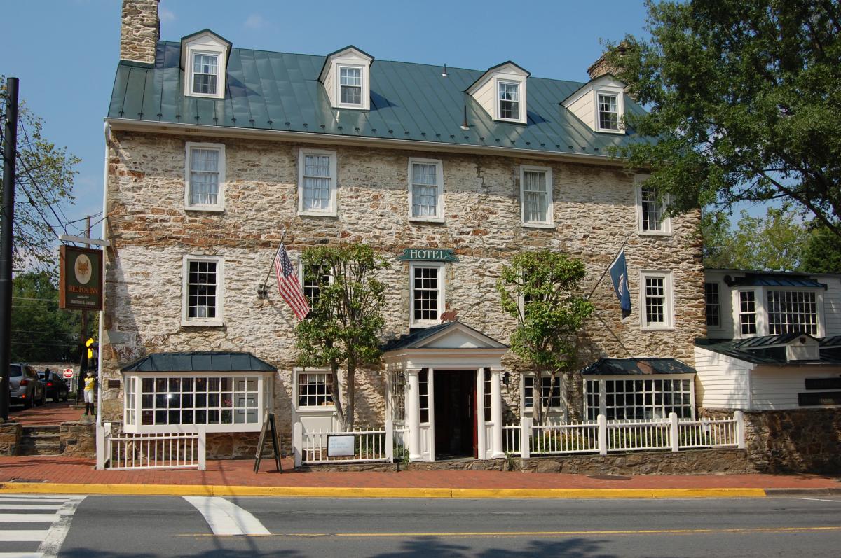 Historic fieldstone exterior of the Red Fox Inn and Tavern on the main street of Middleburg in Loudoun