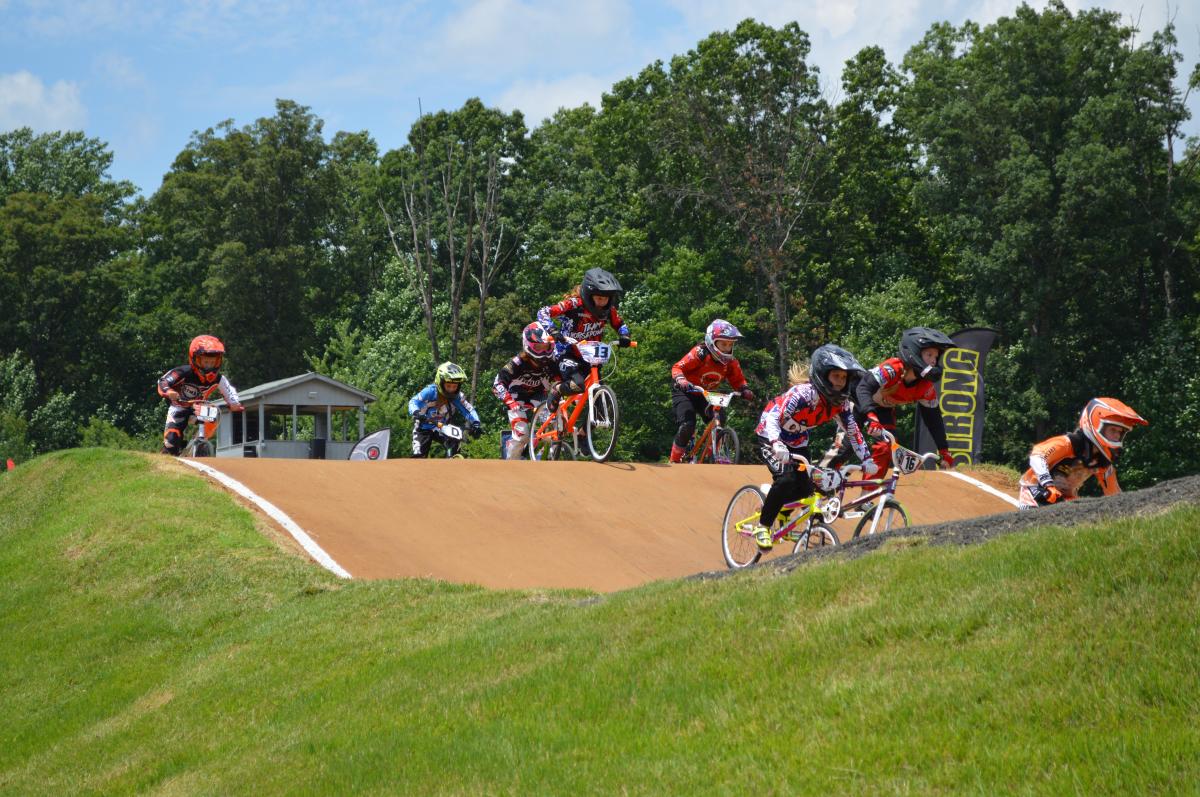 young BMX bikers participating in a race on a course