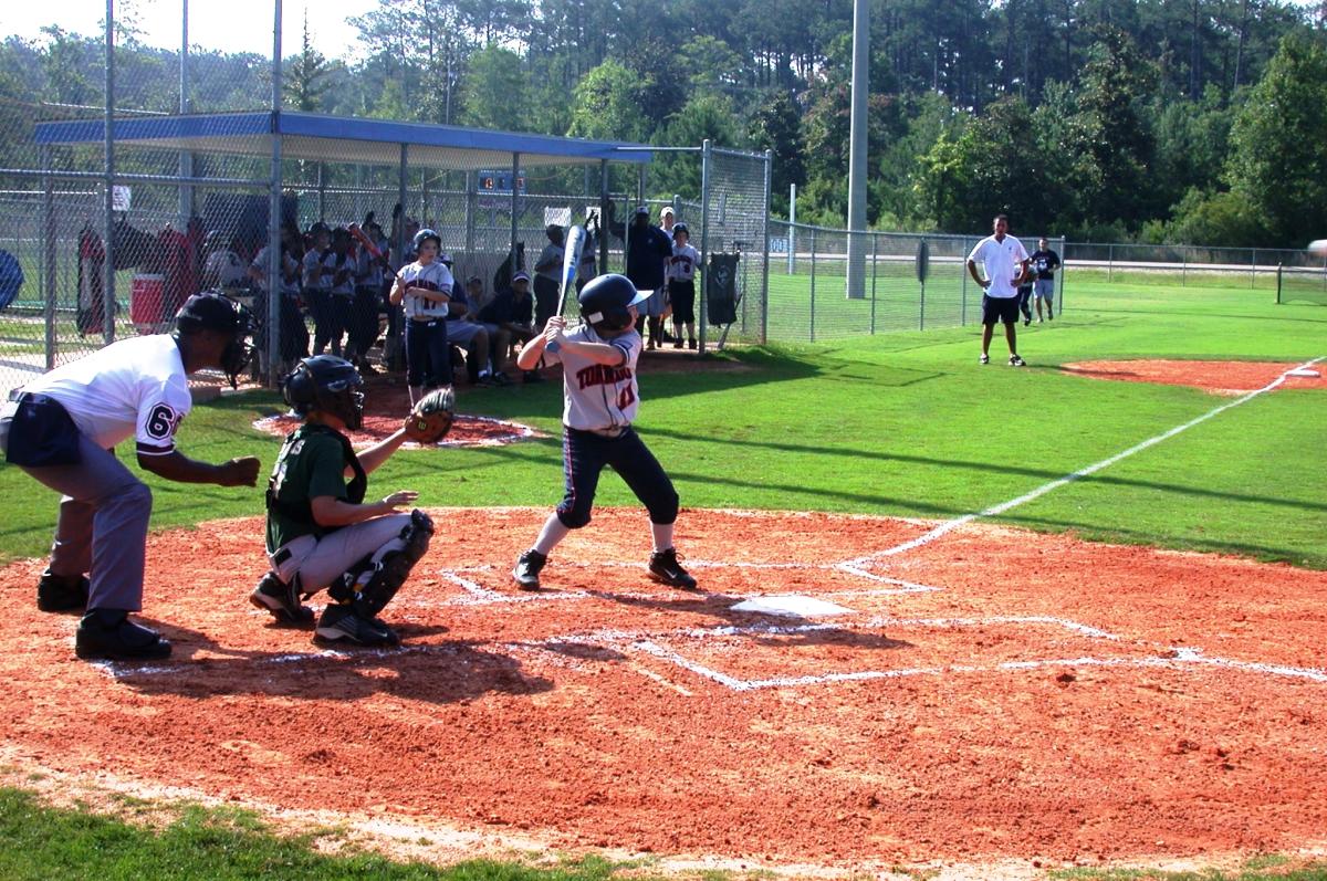 Kids Playing Softball at Pelican Park in Mandeville
