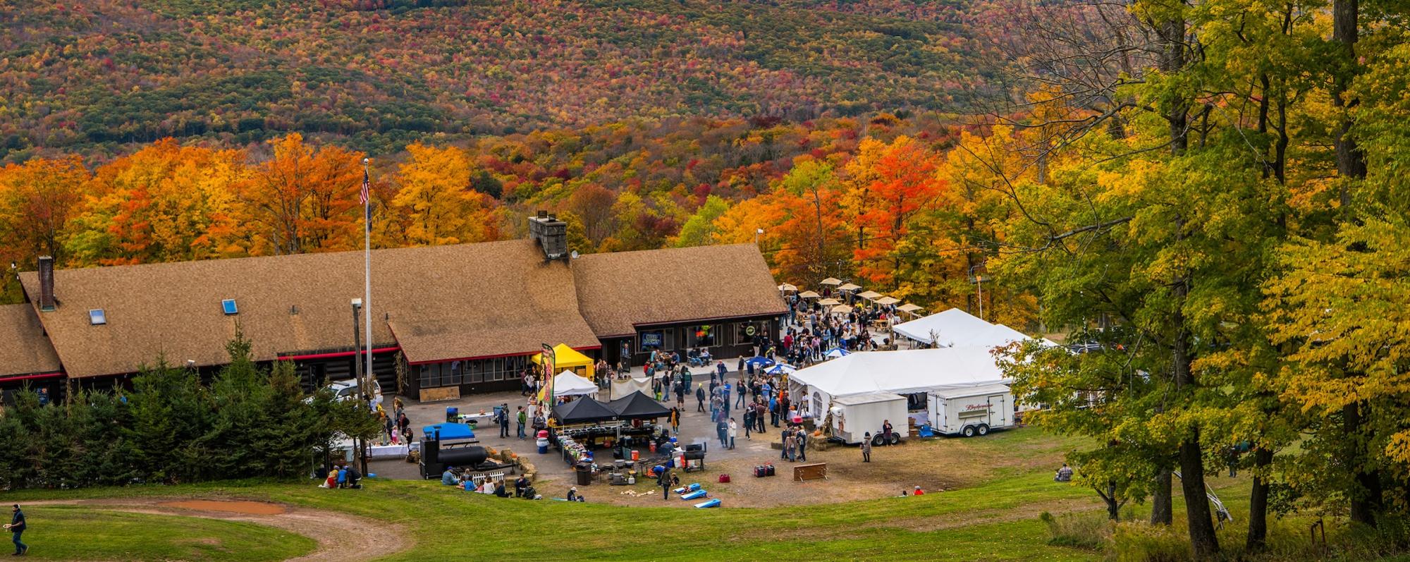 People gather at tents set up at the Belleayre Mountain Fall Festival