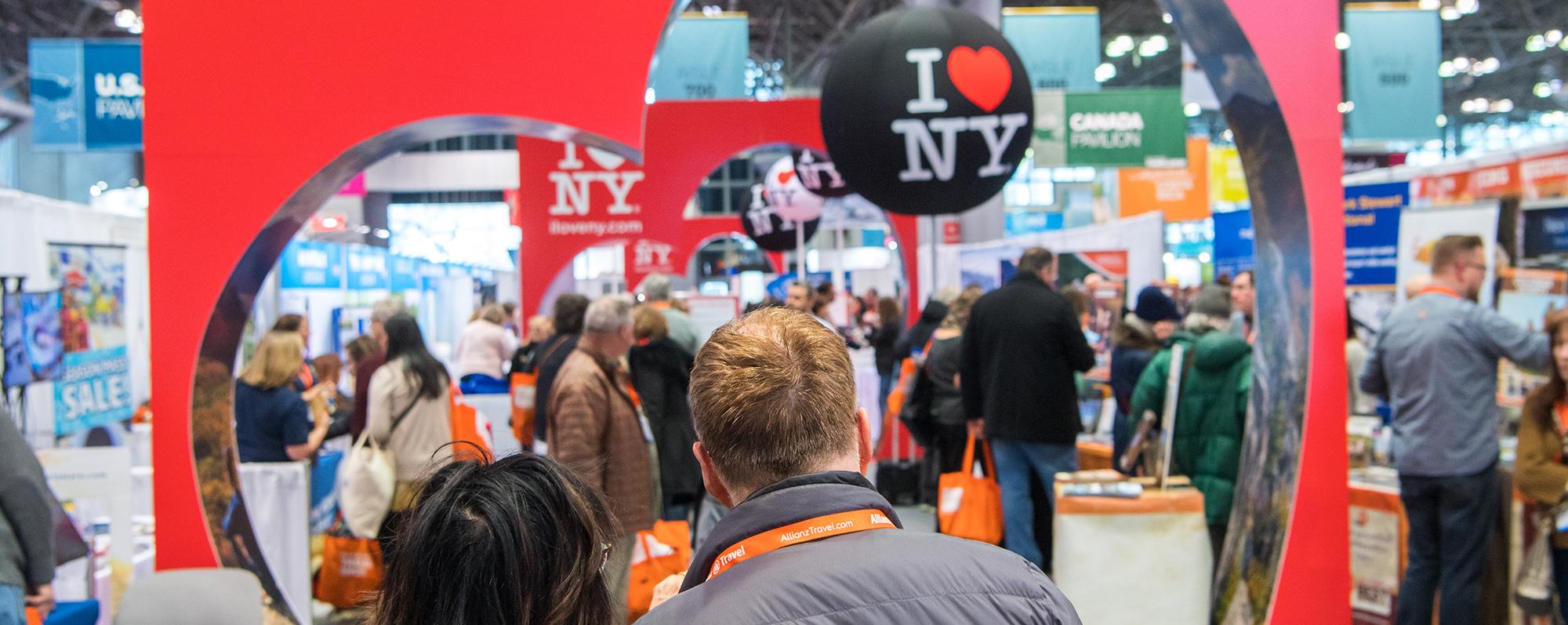 A couple enter the New York Times Travel Show at the Javits Center