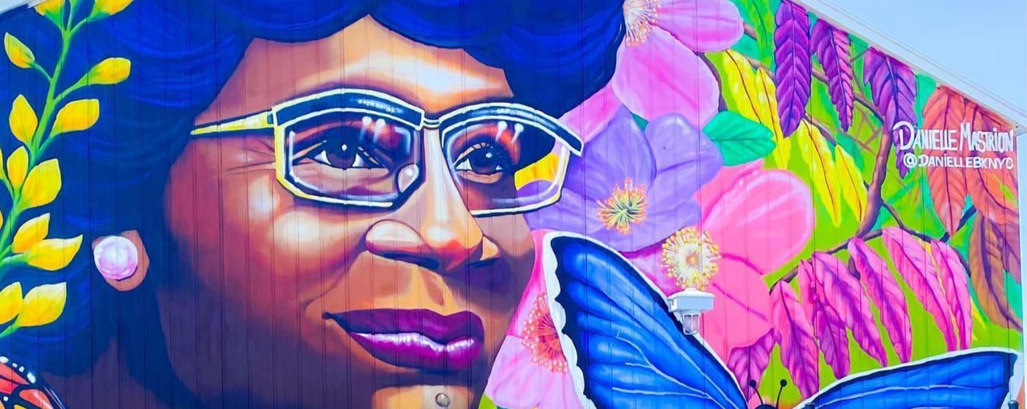 a multicolored mural of shirley chisholm in shirley chisholm state park
