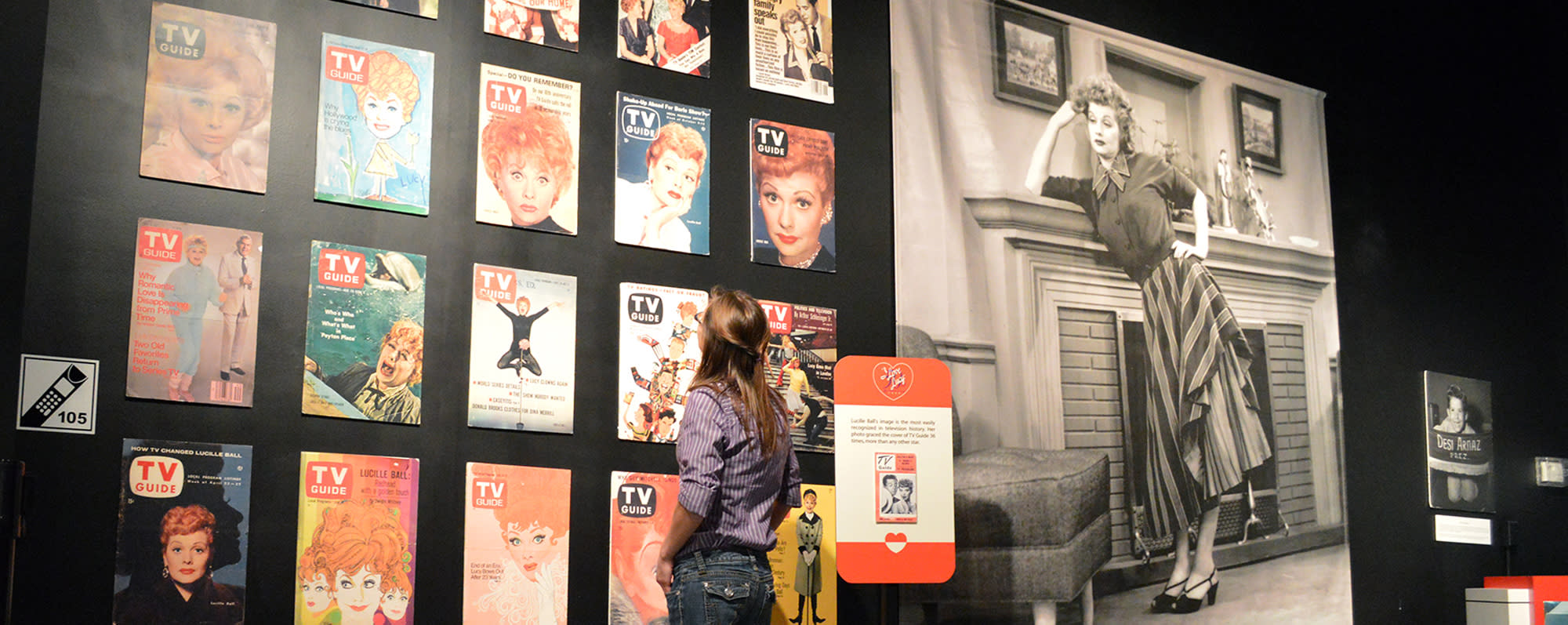 A girl standing and looking at a display at the Lucille Ball Desi Arnaz Museum