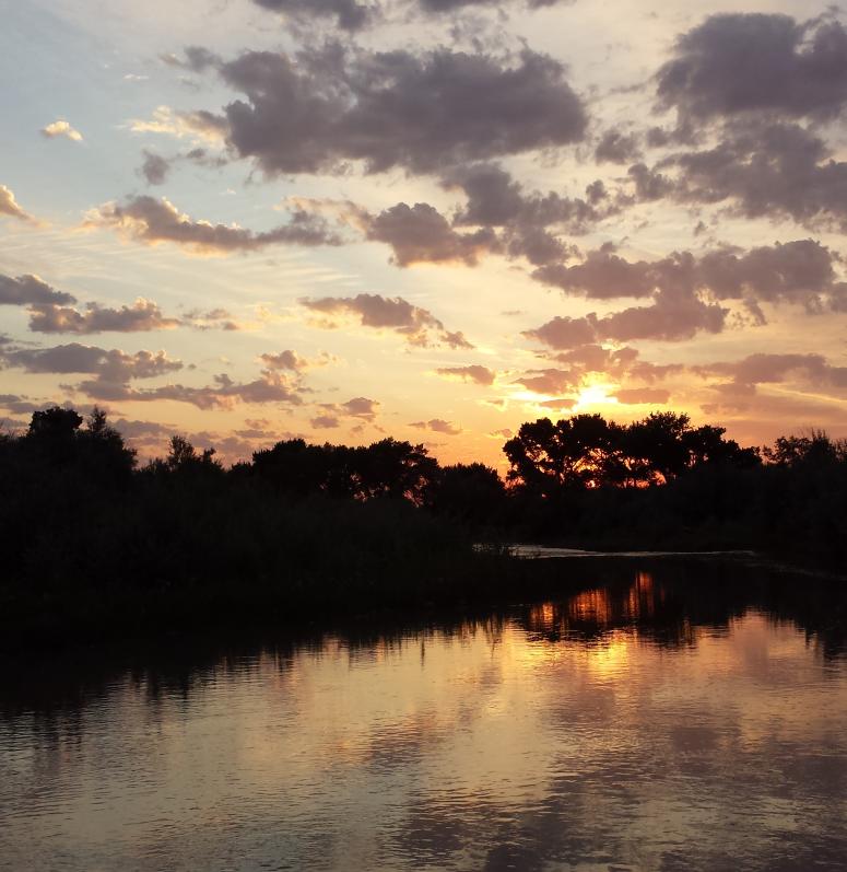 Sunset over a river in Duchesne County