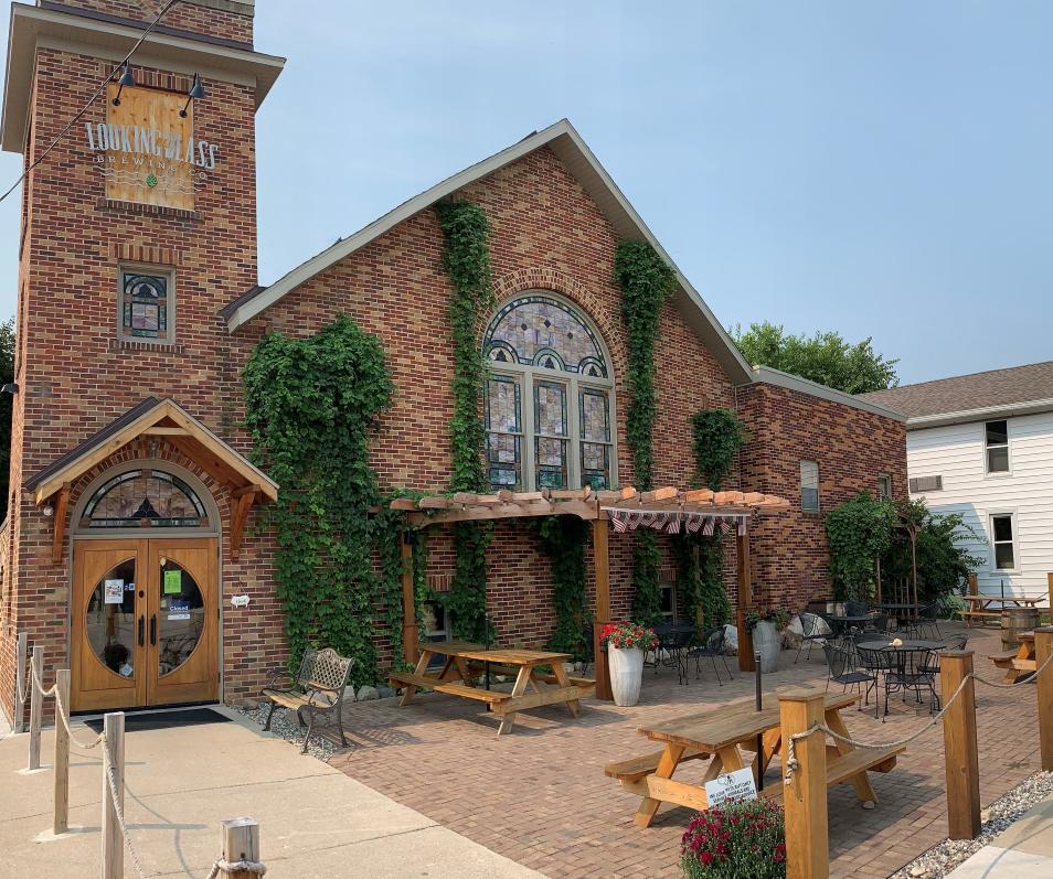 Patio of brewery with picnic tables and tables and chairs