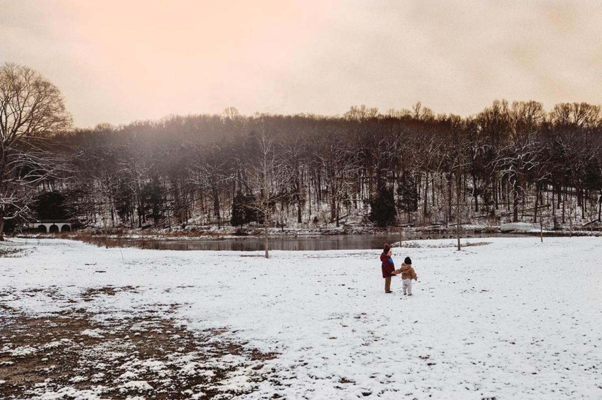children play in the snow at Dunbar Cave State Park
