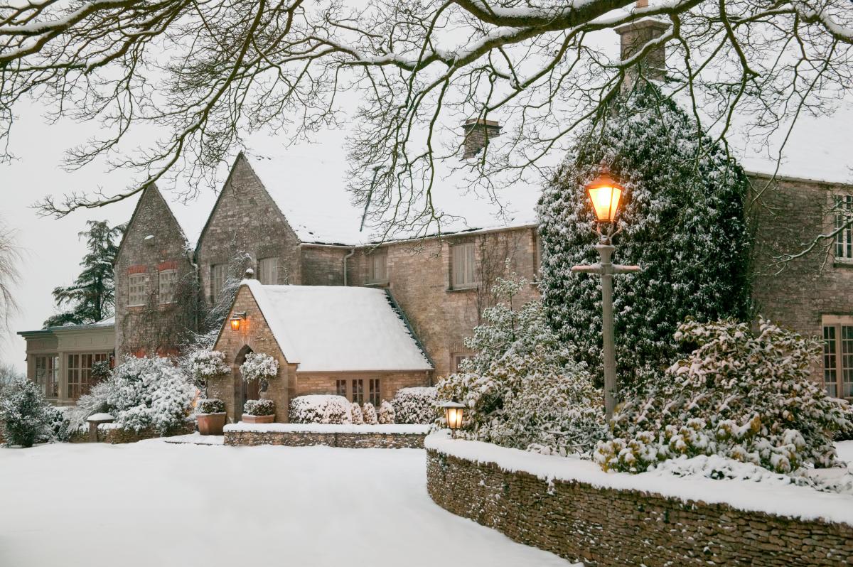 A snowy exterior shot of Calcot & Spa