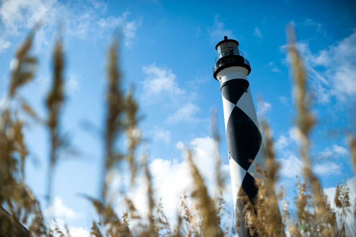 Lighthouse through the sea oats