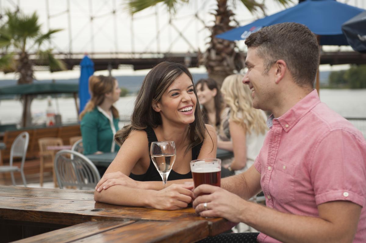 A couple enjoys cocktails on the patio at Dockside Willies in Wormleysburg, PA