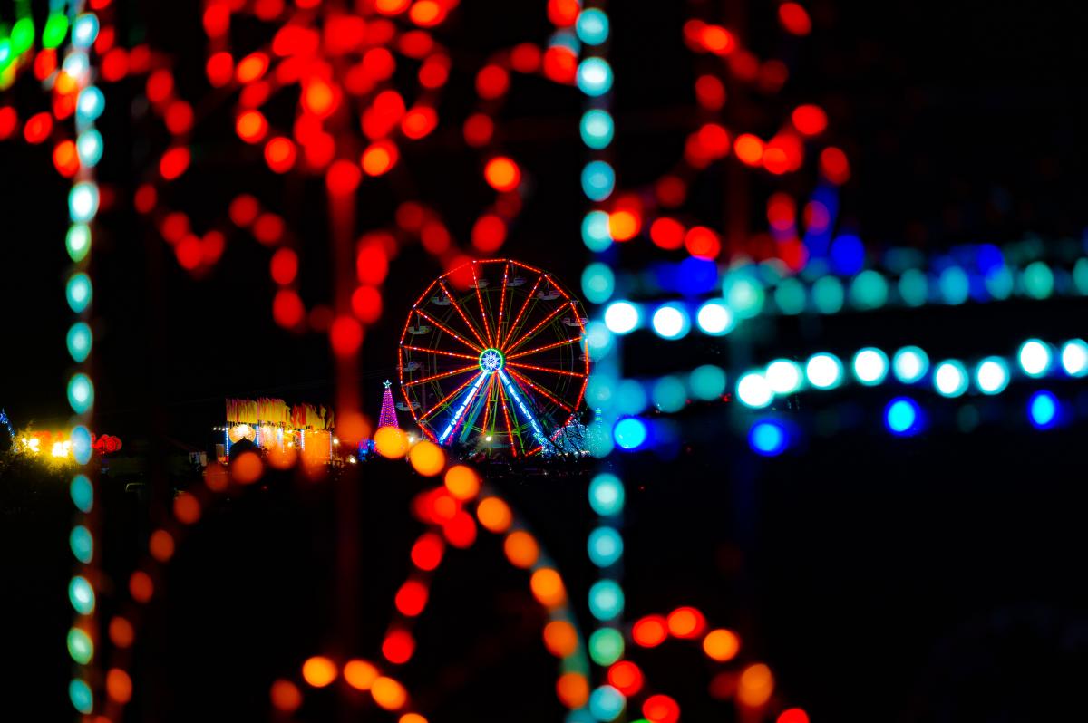 Light show at Bull Run with Ferris wheel in the center and twinkling lights surounding