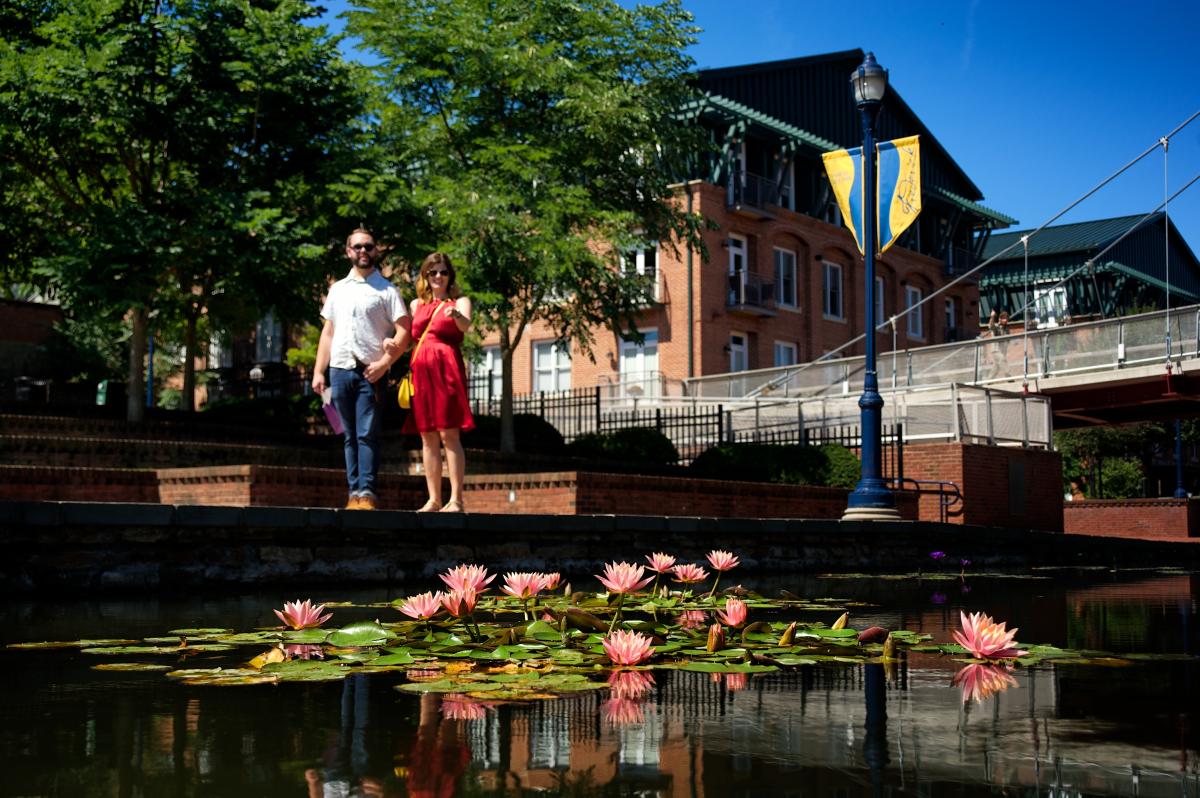 A couple posing for the camera at Carroll Creek Park