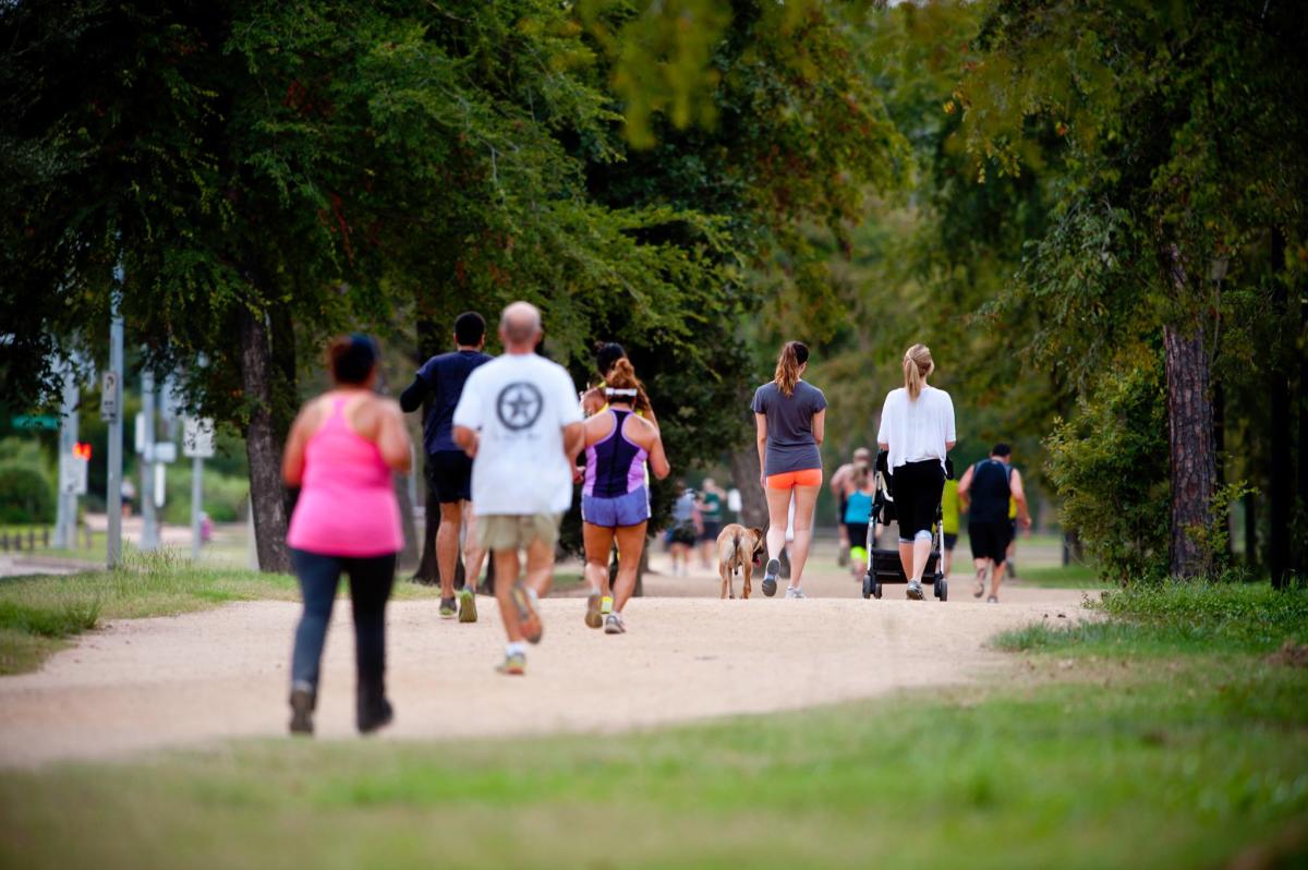 People Walking In Memorial Park In Houston, TX