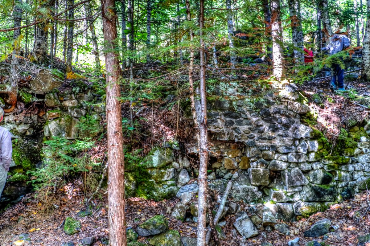 Some people can be seen exploring mine ruins.