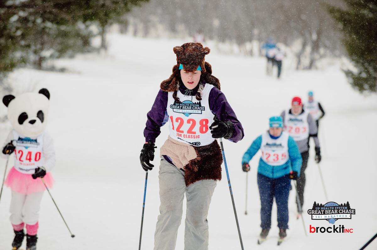 skiers wear plush bear hats while they race