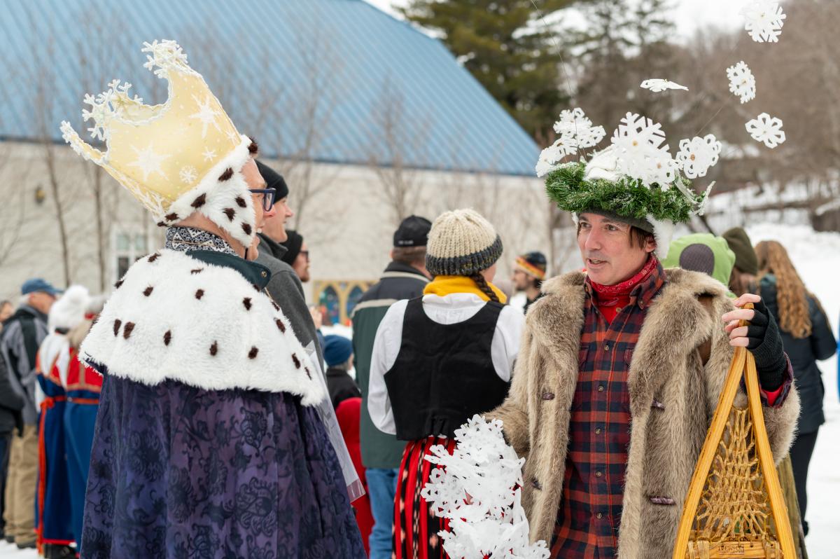 two costumed people talk together