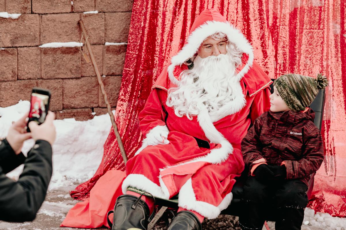 Boy gets a photo with Santa