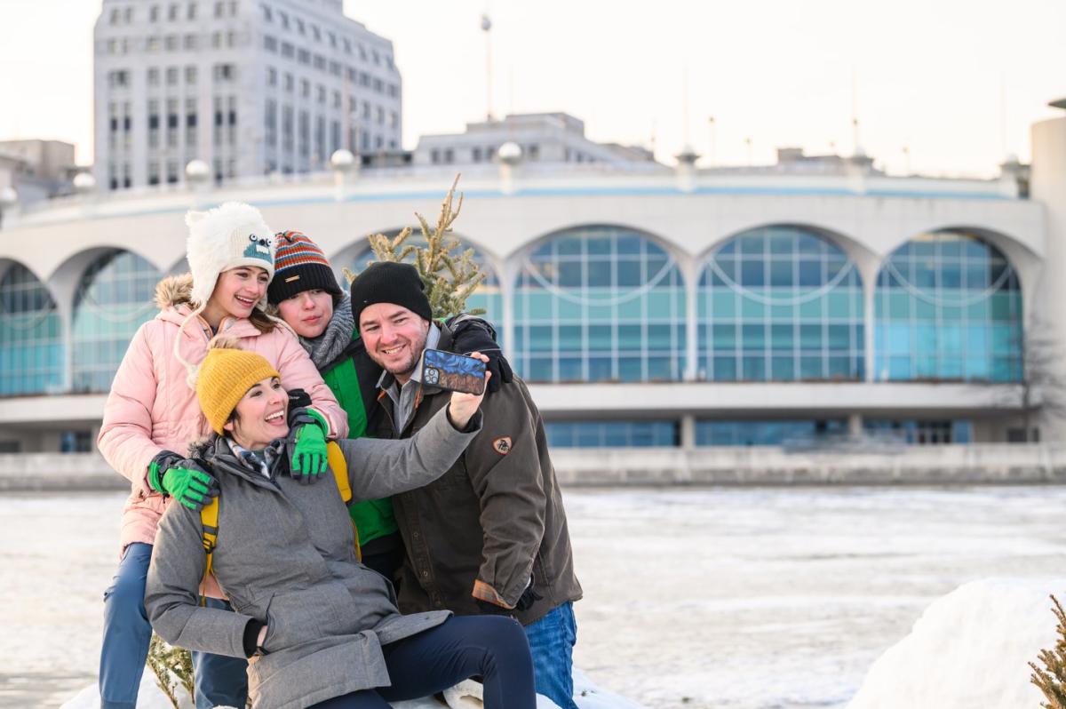 A family takes a selfie on frozen Lake Monona