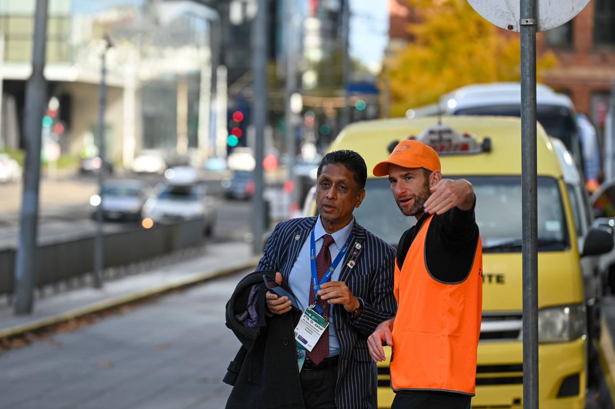 Volunteer giving directions to Rotarian RICON23 Melbourne