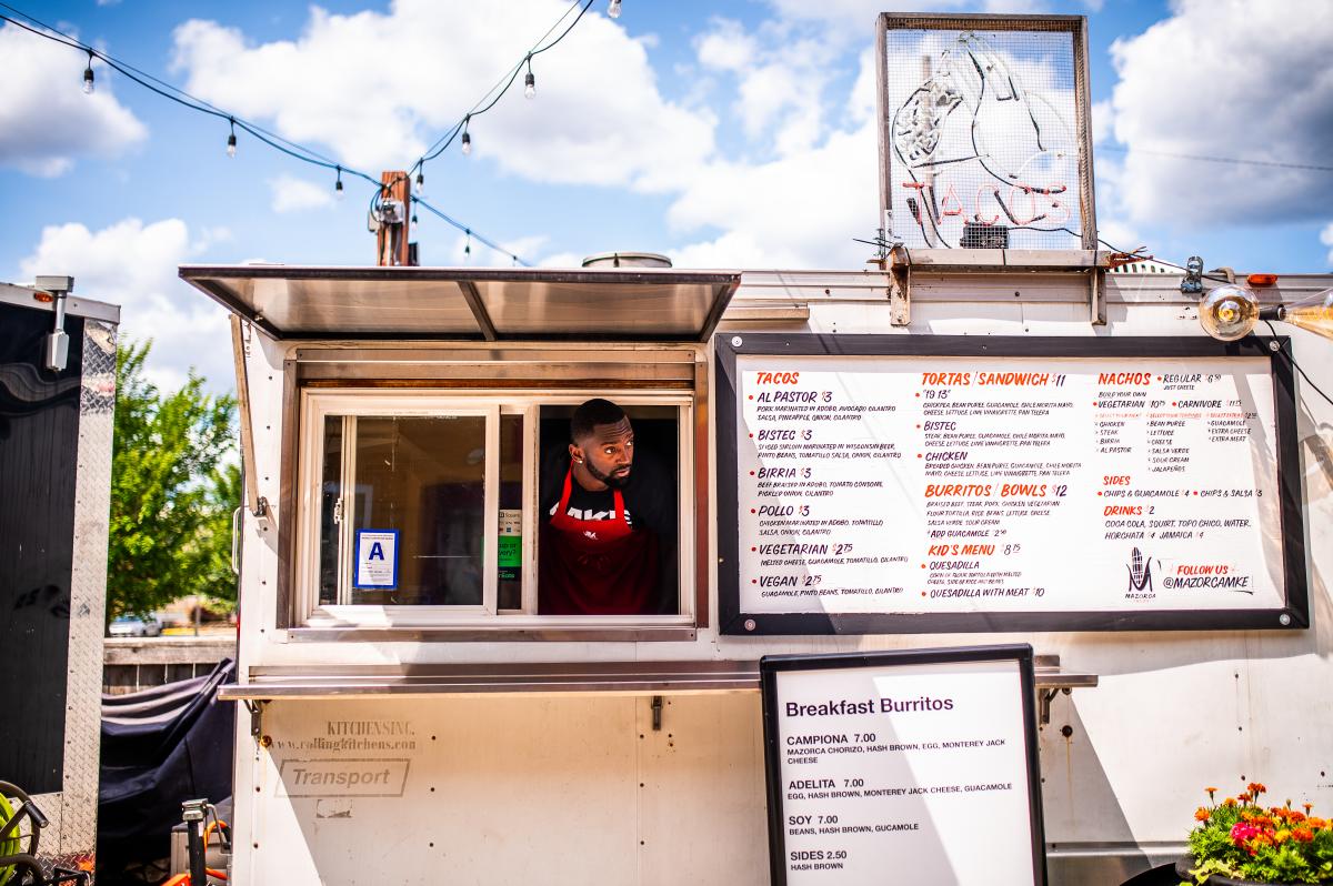 Bobby Portis sticking his head out of a taco food truck service window