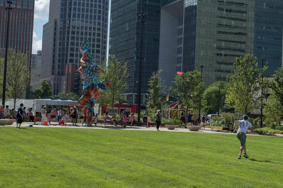 People playing frisbee at Gene Leahy Mall at The RiverFront.