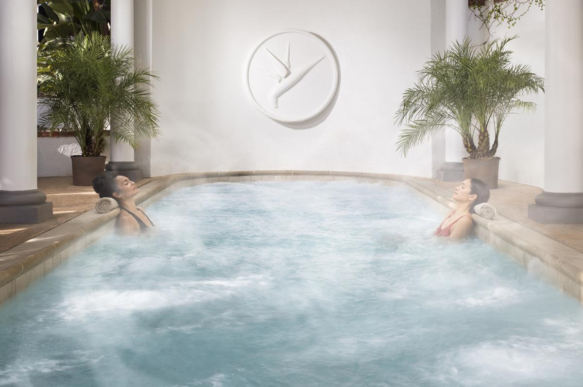 Two women relaxing in a pool at Glen Ivy Hot Springs in Corona, CA