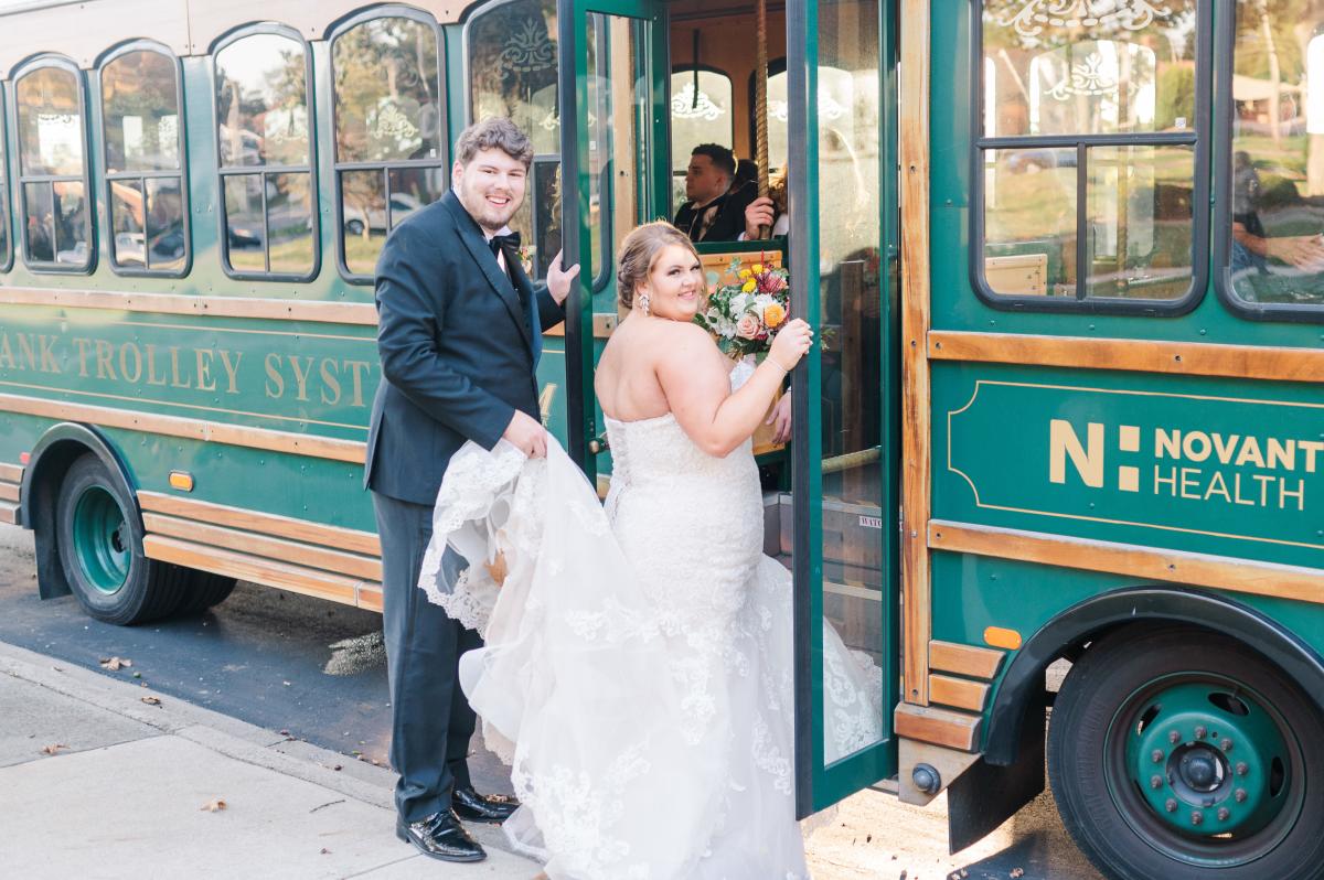 Wedding couple getting on trolley