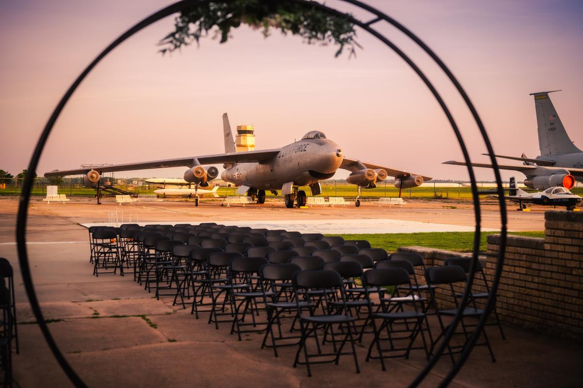 Seats are set up for a wedding outside at the Kansas Aviation Museum