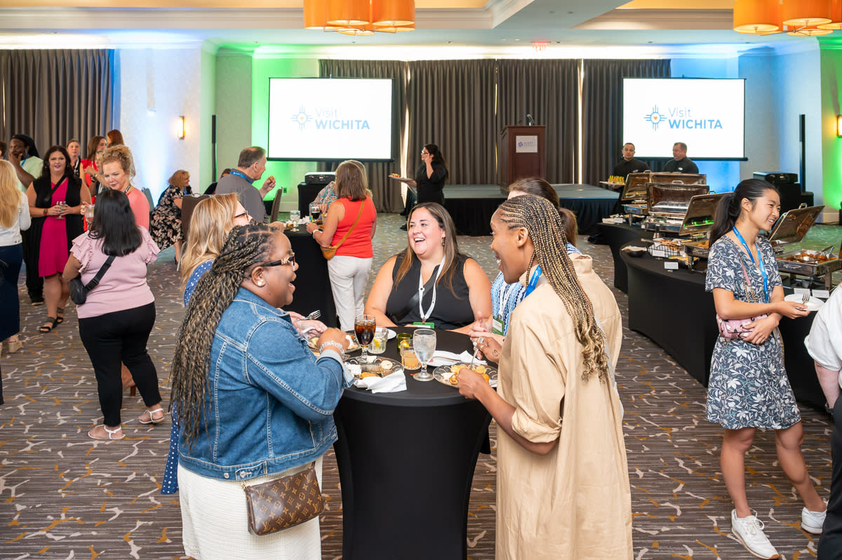 Meeting planners mingle at a welcome reception during the Destination Midwest conference at the Hyatt Regency Wichita hotel