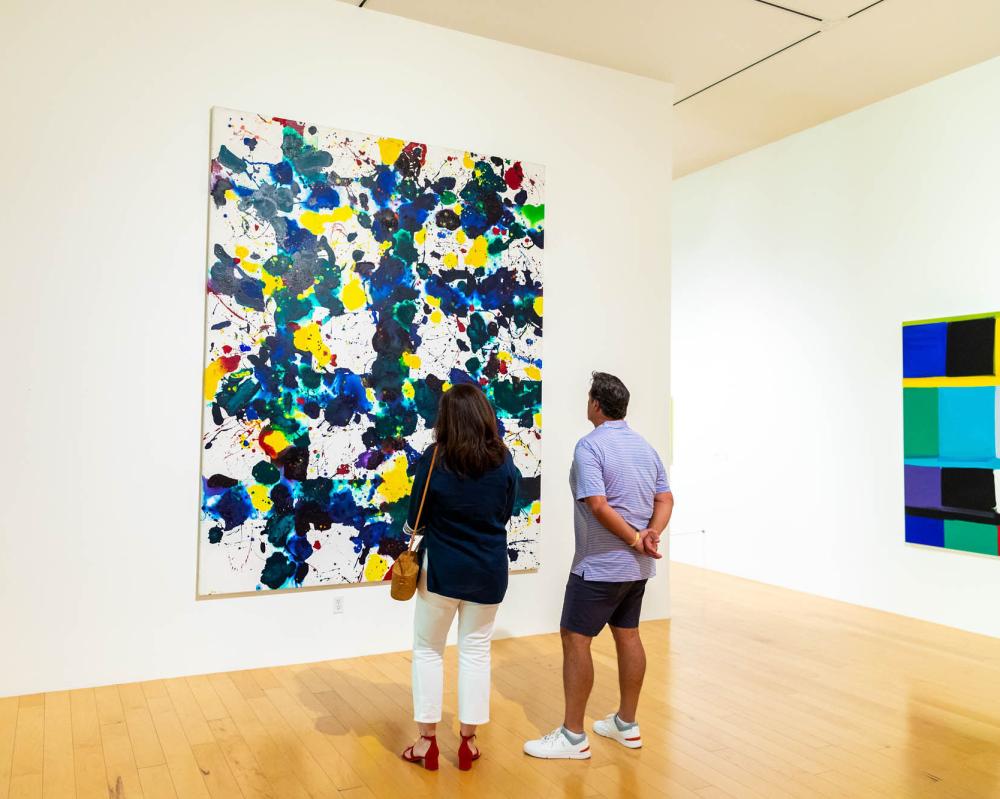 A couple looking at a painting at the Palm Springs Art Museum