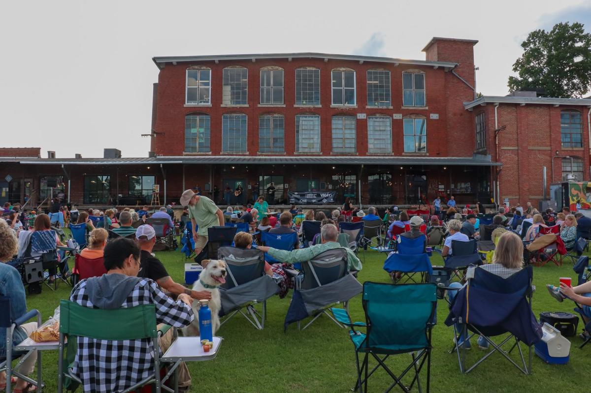 pic of a crowd gathered to watch a band play at Lowe Mill