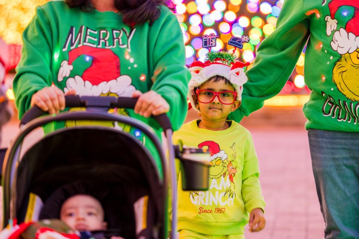 Family at Bentonville Square during Holiday Lights