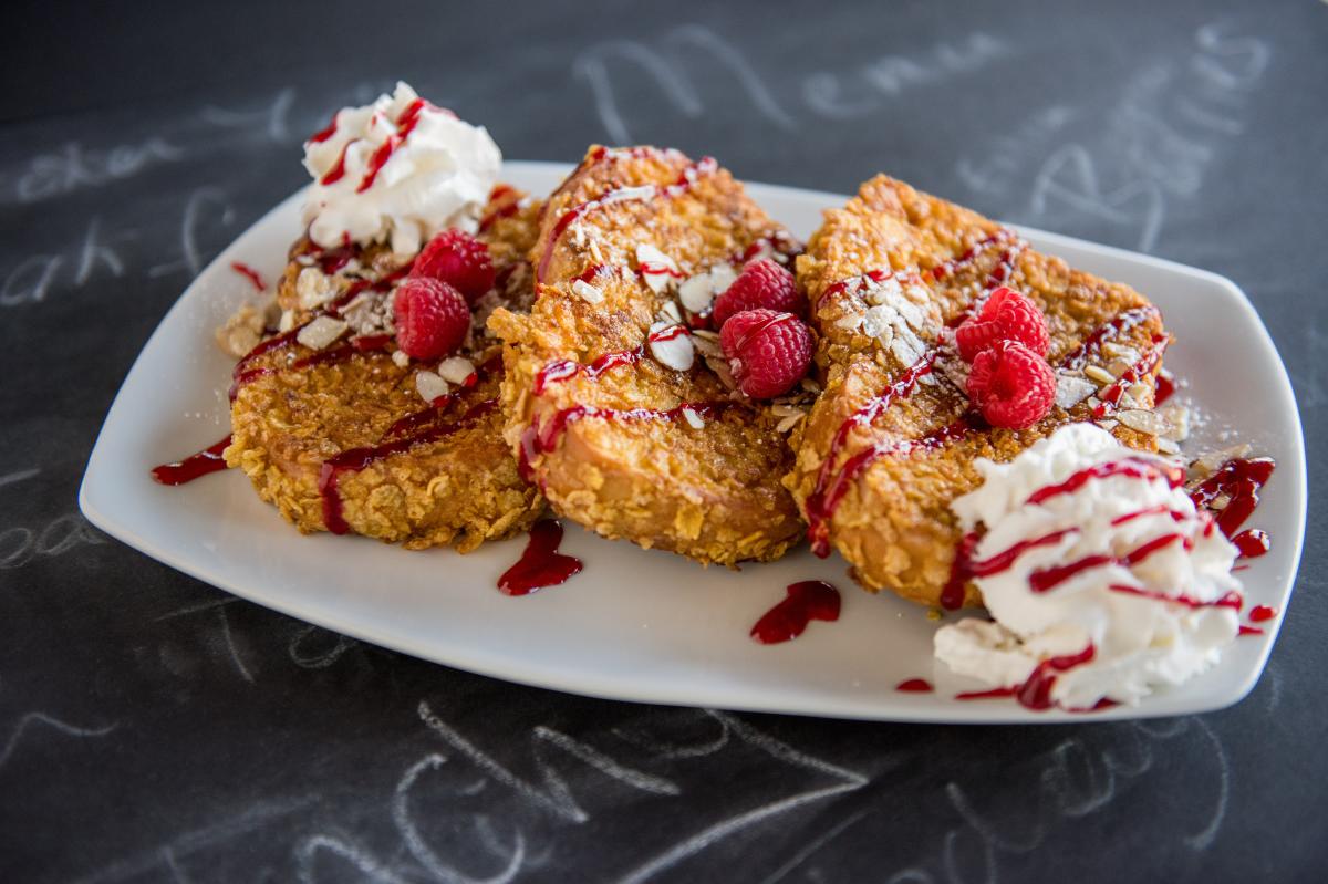 French toast with raspberries on it