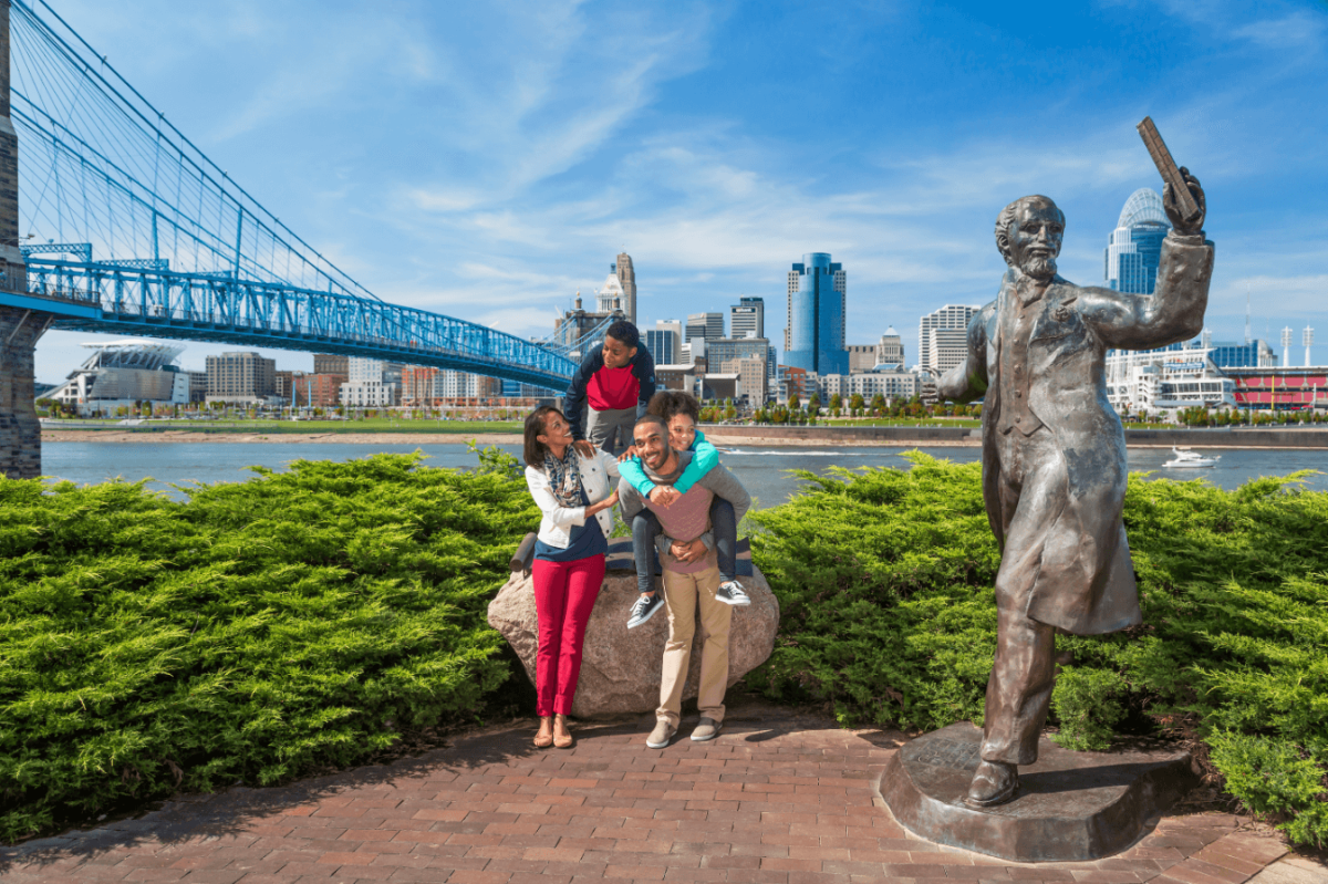 family posing on the Cincinnati waterfront