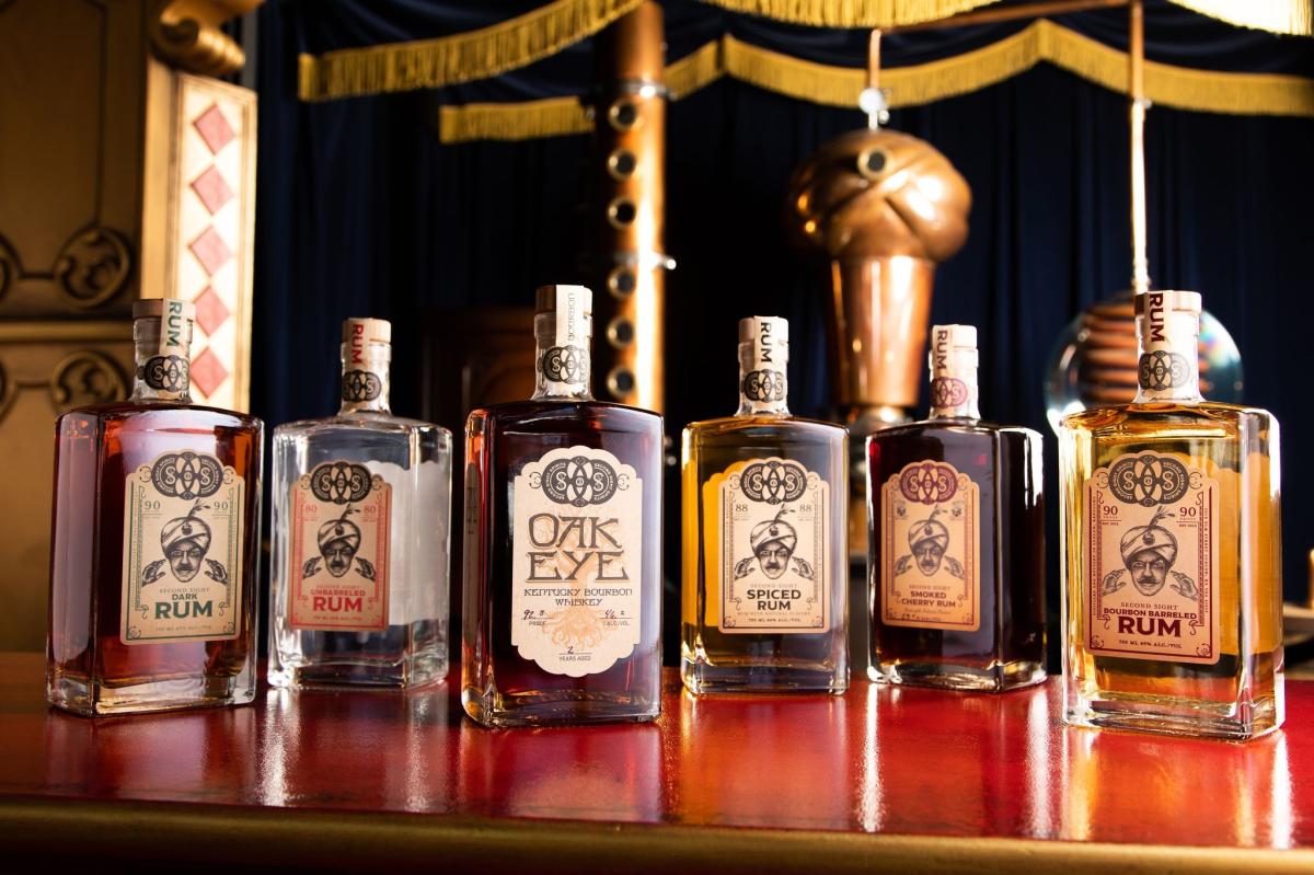 A line of six bottles, one each of the different spirits Second Sight Spirit makes.