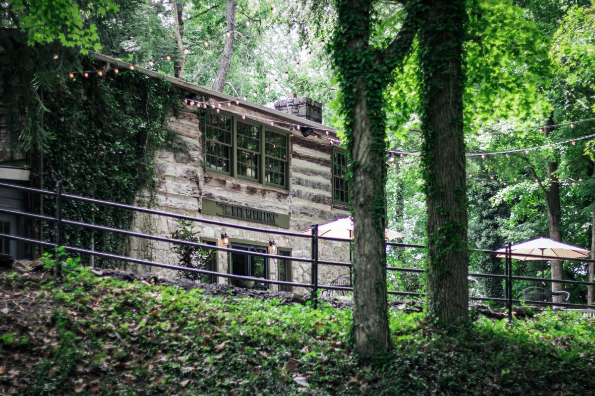 log cabin restaurant surrounded by trees