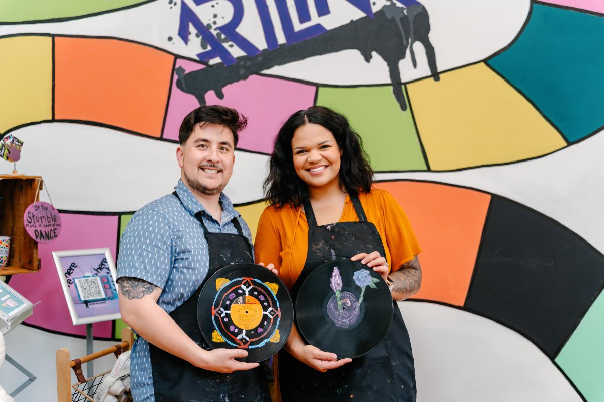 couple posing with painted vinyl records