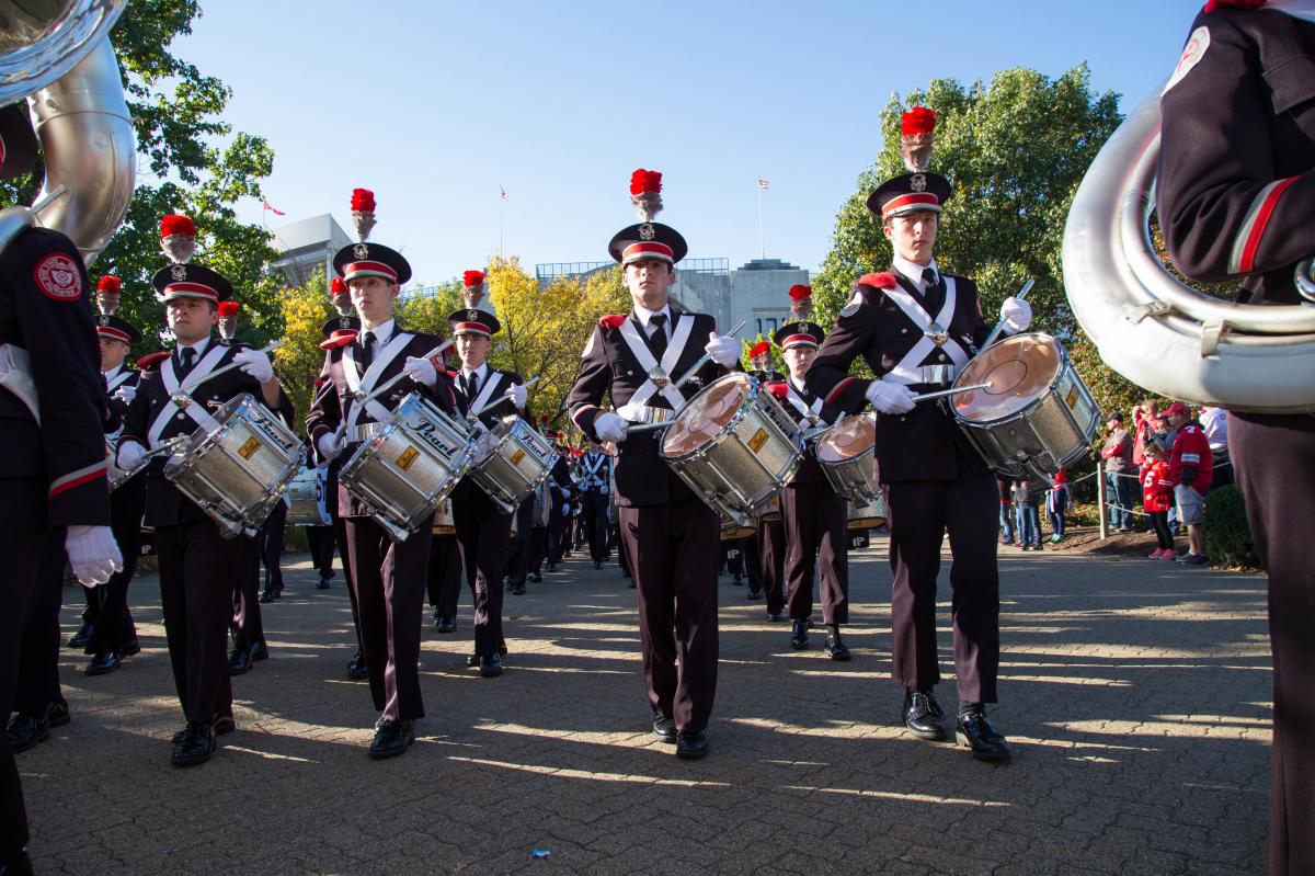 OSU marching band walking through campus before a football game