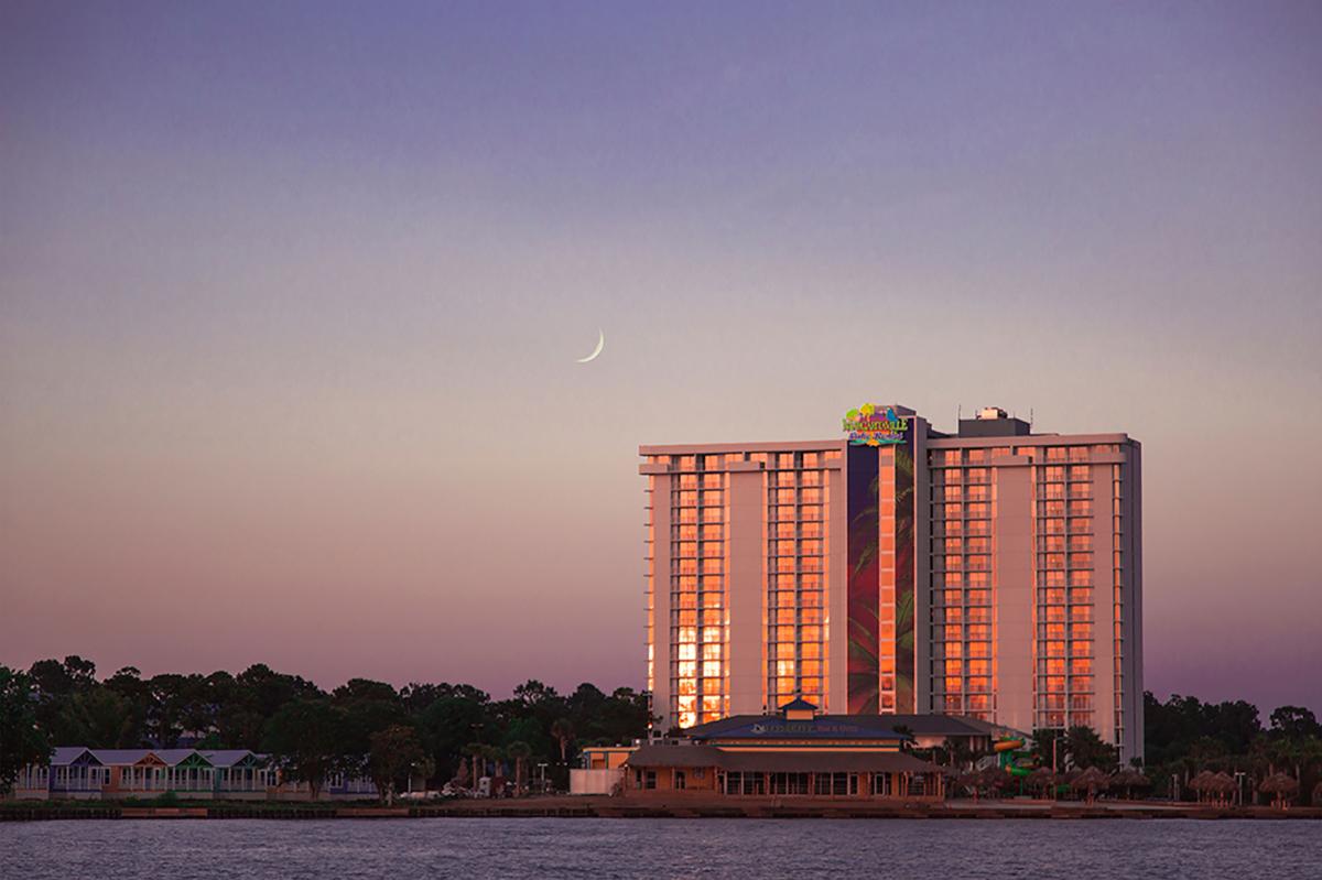 sunset reflection of Margaritaville hotel on Lake Conroe