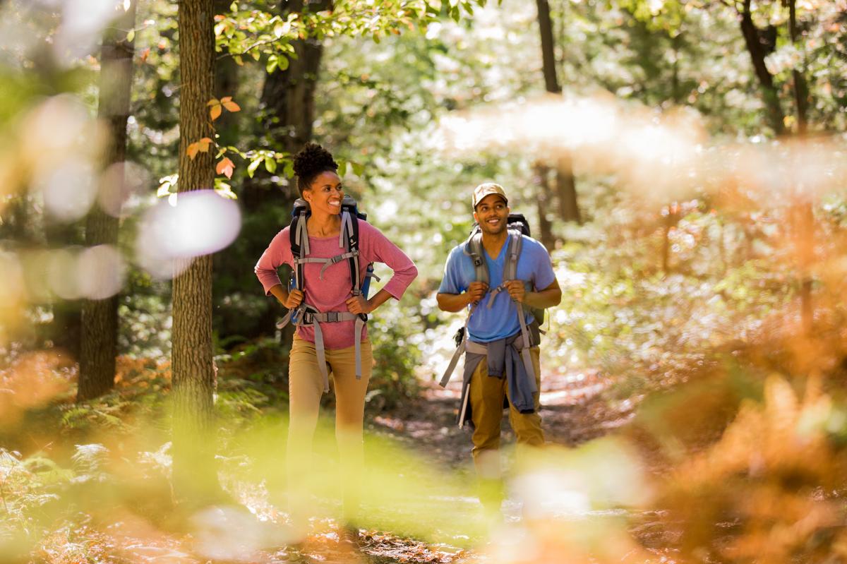 Couple with backpacks hiking the Appalachian Trail