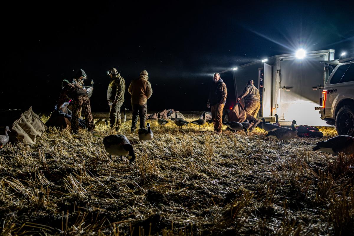 Waterfowl hunters setting up decoys in Devils Lake, ND.